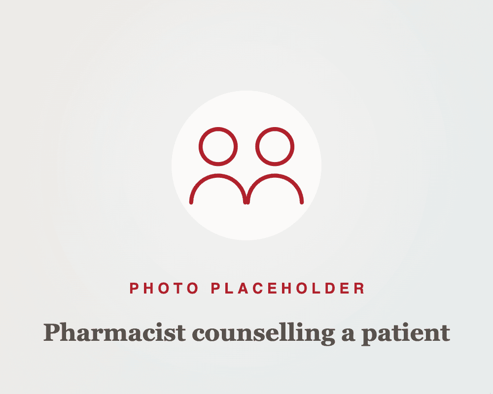 Pharmacist counselling a patient at the counter